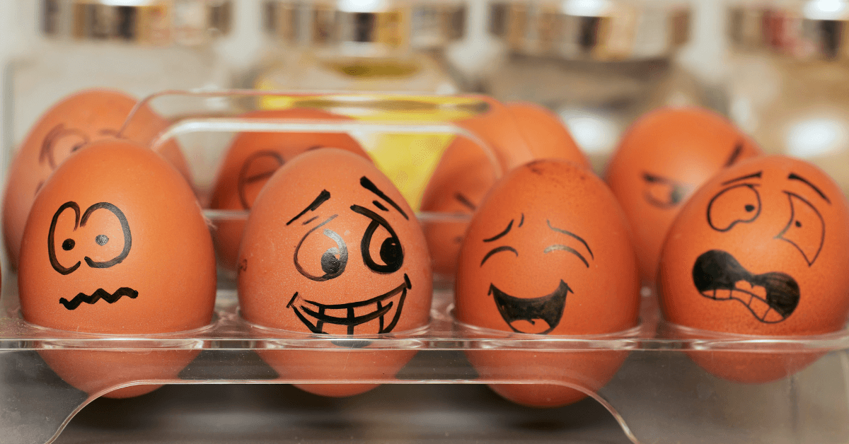 Laughing cartoon faces drawn onto eggs